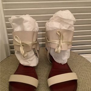 Tan half booth sandal with ribbon tie.